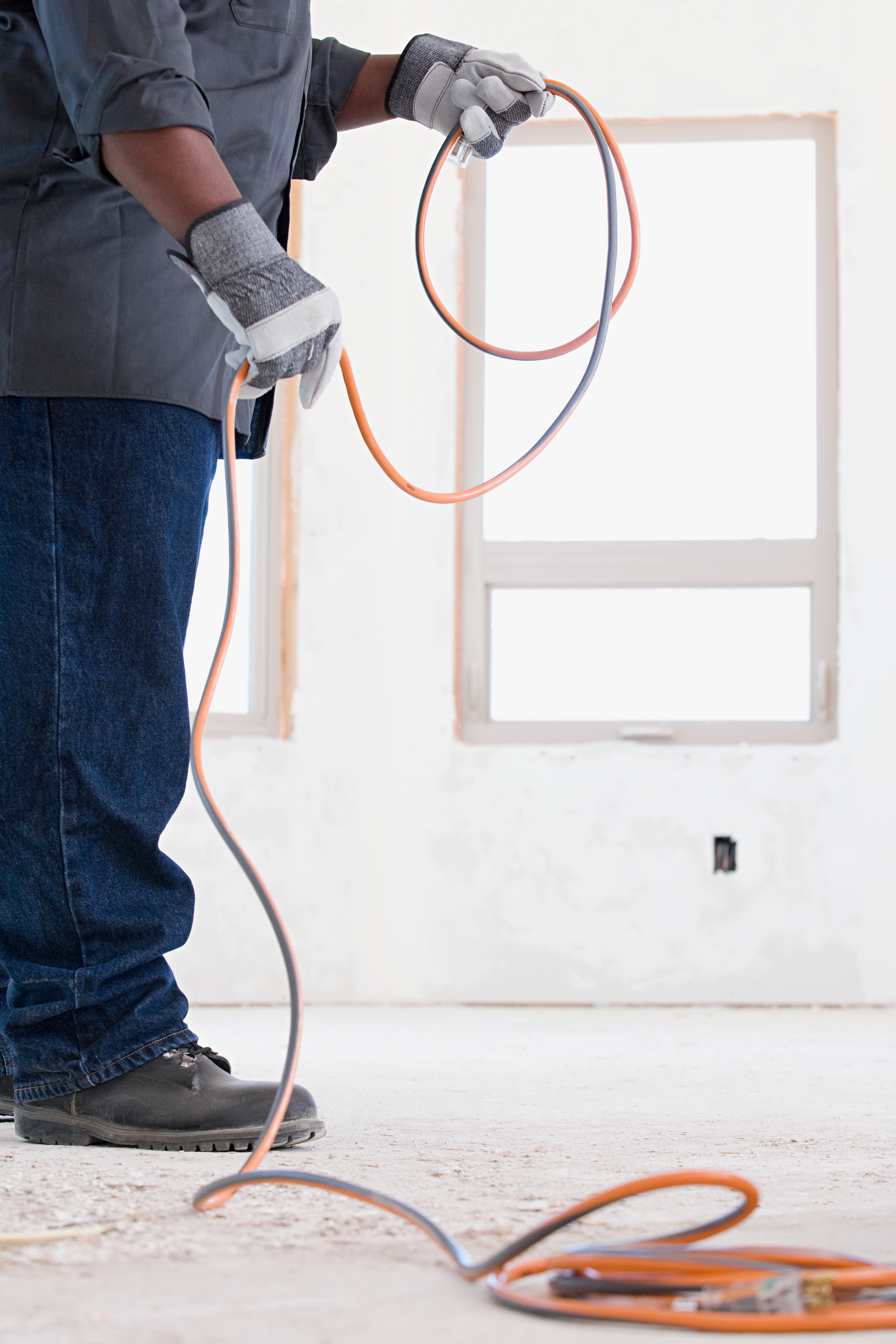 Electrician Holding Electrical Cable